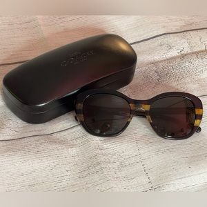 Tortoiseshell coach sunglasses.